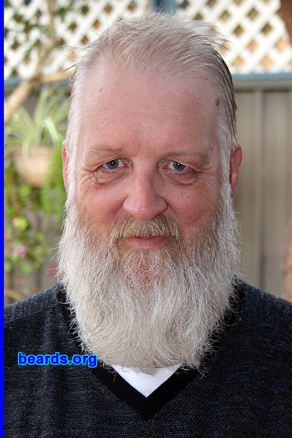 Mick
Bearded since: 1975. I am a dedicated, permanent beard grower.

Comments:
I liked the "rebel" look a beard projected back in the '60s and '70s.  So as soon as I could do so, I started on mine. In the years since, I've varied it from "designer stubble" through to full-on ZZ Top in style and length. Settled on the current style about fifteen years ago.

How do I feel about my beard? It is a part of me now. I could no more remove it than I could remove my arm.
Keywords: full_beard