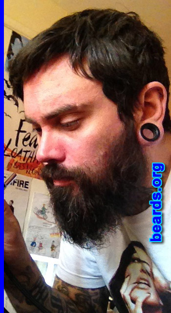 Jon
Bearded since: 2012. I am a dedicated, permanent beard grower.

Comments:
Why did I grow my beard? Originally it was intended to make my throat tattoo feasible with work.  It has now become a permanent part of how I look and always seems to evoke a good response from people that I meet.

How do I feel about my beard? My father is an ex Royal Navy man and has been bearded my whole life. My beard is an expression of strength and connects me to him. I have been asked by prospective partners to shave it off, but it is still there and is improving all the time. I definitely see it as a work in progress.
Keywords: full_beard