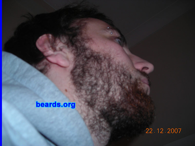 Steven
Bearded since: 2005.  I am a dedicated, permanent beard grower.

Comments:
I was too lazy to shave it off, and so I just kept growing it.

How do I feel about my beard?  I often bite the hairs of my beard by pushing it to the side of my mouth, which is a bad habit. My beard puts a lot of age onto my face, but during winter time it can keep my face very warm. My family often say, "Steven, get a shave.  You look like you sell the big issue!".  I'm proud of my rough look.  I hope you like it, too.
Keywords: full_beard