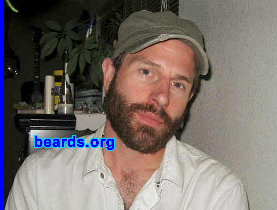 Gregory
Bearded since: September 1, 2007.  I am an experimental beard grower.

Comments:
To be honest, I find that most people either don't like beards or just feel like they're "odd" and I've always had a personality type that just likes to irritate people in harmless little ways. I love beards and always have but I have some itchy, red psoriasis-like skin trouble that always made me abandon growing my beard around Week 4. This time, I toughed it out. 

How do I feel about my beard?  My favorite part of having a beard is the 30-60 minutes after a shower when the beard is still moist and cool and also the sensation of the wind when I ride my bike. 

I love my beard...  It's pretty full and has every color imaginable in it. The only thing I don't like is that it makes me look ten years older and accentuates my tired-looking eyes. 

It's curious to note that my wife finally conceived the very same week I stopped shaving. So beware, fellas! Haha.

Pictured here:  the beard at five weeks.
Keywords: full_beard