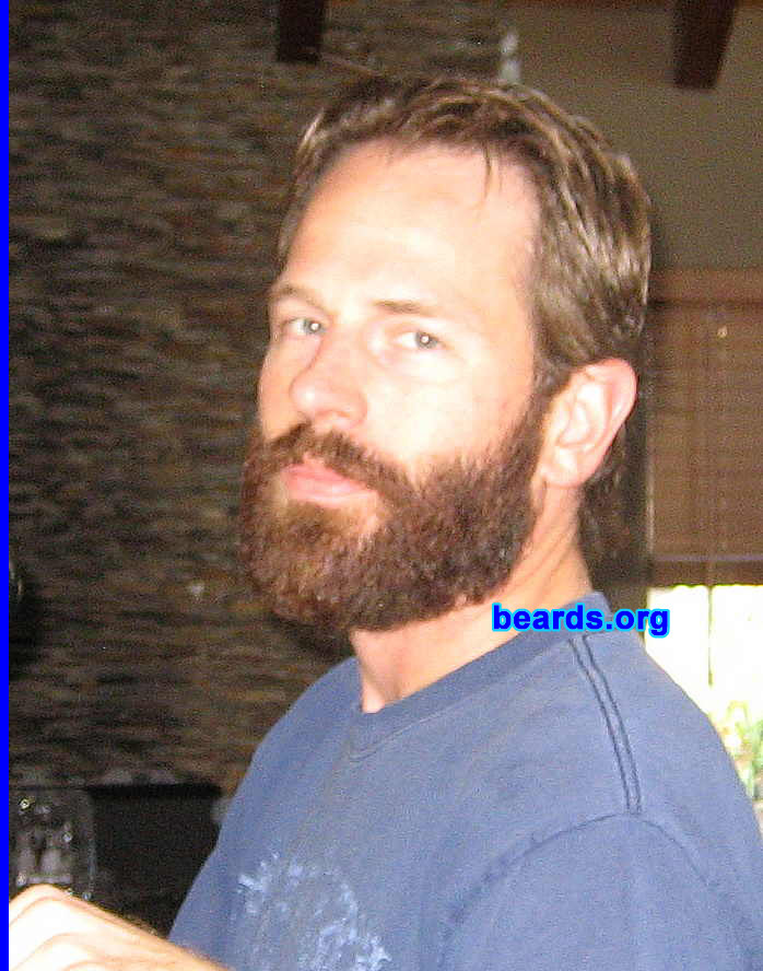 Gregory
Bearded since: September 1, 2007.  I am an experimental beard grower.

Comments:
To be honest, I find that most people either don't like beards or just feel like they're "odd" and I've always had a personality type that just likes to irritate people in harmless little ways. I love beards and always have but I have some itchy, red psoriasis-like skin trouble that always made me abandon growing my beard around Week 4. This time, I toughed it out. 

How do I feel about my beard?  My favorite part of having a beard is the 30-60 minutes after a shower when the beard is still moist and cool and also the sensation of the wind when I ride my bike. 

I love my beard...  It's pretty full and has every color imaginable in it. The only thing I don't like is that it makes me look ten years older and accentuates my tired-looking eyes. 

It's curious to note that my wife finally conceived the very same week I stopped shaving. So beware, fellas! Haha.

Pictured here:  the beard at ten weeks.
Keywords: full_beard