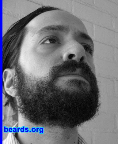 Ian
Bearded since: 2008.  I am a dedicated, permanent beard grower.

Comments:
I wanted to see what my beard would look like if I just let it grow. Before this beard, I always had a goatee, mustache, or fu-manchu and I just got tired of the trimming. I only shave a one-inch strip at the bottom of my neck now.

How do I feel about my beard?  I think it's pretty cool. It's definitely a work-in-progress. I think I want to grow it until it's long enough to braid it.
Keywords: full_beard