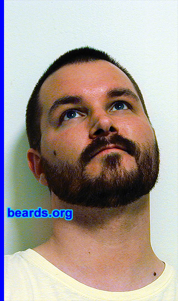 Kenzie LaMar
Bearded since: 1999.  I am a dedicated, permanent beard grower.

Comments:
I grew my beard because  I love them on men and had wanted one for myself for years, but couldn't grow one that looked full enough.  When I turned 21, I finally let it grow fully.  It was almost there.  I shaved it and then regrew it a year later.  Had one ever since.  I do art of bearded men.  I am a trained painter.  I am a pogonophile and love hair growth all over the male body.

How do I feel about my beard?  I like it and get lots of compliments that it looks good on me.  I wish it were more full and had less bald spots.  I would like it to be darker, too.  I am trying to grow it a bit longer now, but the hair is so straight that it just starts to stick out everywhere and looks bad.  Guys that have a bit of a curl seem to be able to let therr beards grow much longer and it looks good.  My beard isn't full enough to grow a really long beard.  It would look really bad.  That's fine, though, because I like shorter beards to medium length.
Keywords: full_beard