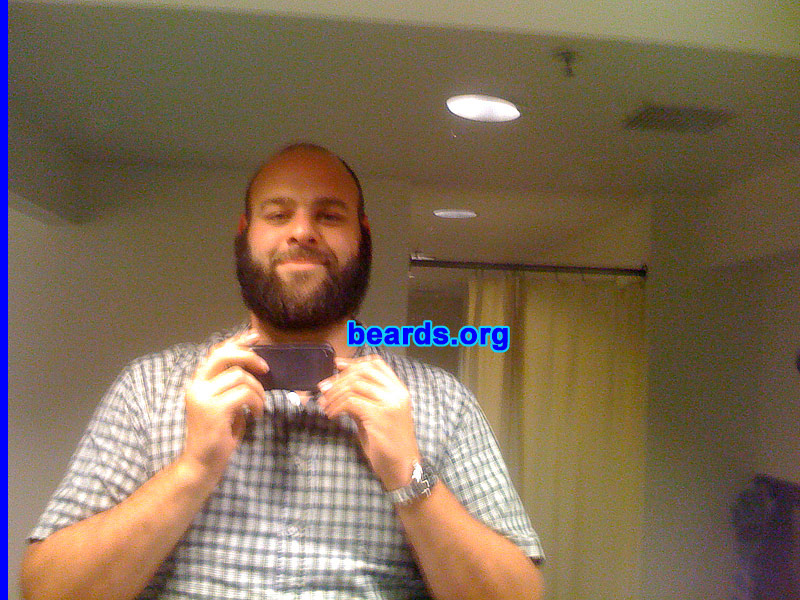 Matt
Bearded since: April 2010.  I am an experimental beard grower.

Comments:
I get really bored with the day-to-day shaving thing.  So about every four to six months I change it up and do something new. My most recent ones are the full bread, provided in the attached pics and the friendly mutton chops. I'll have to find some pics of that beard when I had it.

How do I feel about my beard? I love my beard. It's long enough for my girlfriend to actually lose her fingers in it (although she does lock up sometimes and then it's like she has a rope attached to my face and I can't get away).  I usually get a "love your beard" comment two-three times per week.
Keywords: full_beard