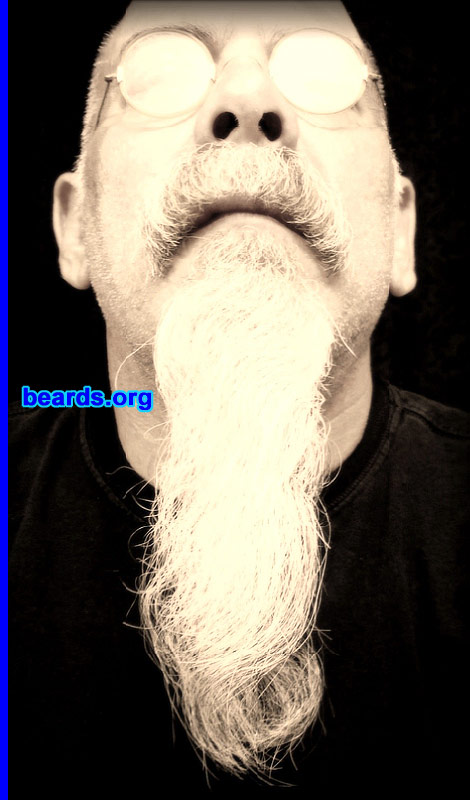 Michael K.
Bearded since: 1978.  I am a dedicated, permanent beard grower.  I am an occasional or seasonal beard grower.  I am an experimental beard grower.

Comments:
I grew my beard because I come from a bearded family.   So it was, without question, the thing to do. As far as the question as to the type of beard grower I am, I feel like I fall into all three descriptions: bearded since forever, but it changes with the season and I am experimental with it. I spent my first fifty-three years in the northeast and was almost fully bearded all the time. Now that I live in southern California, I do cut it back to a goatee when it's 110 degrees out. The goatee part is now two years old and growing.

How do I feel about my beard? Hmmm, it's just a part of me and I've enjoyed the changes to now being nearly all white. I also like the fact that my goatee section grows into a ringlet. The most asked question is do I curl it?, NO it grows that way. I do take better care of it now that it's grown to the top of my tummy and continuing to grow. I am glad that the holidays are over and beard-pulling season with it!
Keywords: goatee_mustache