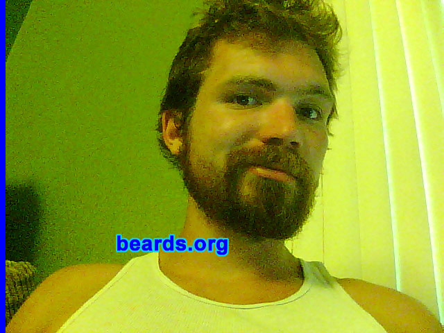 Peter F.
Bearded since: April 2011. I am an experimental beard grower.

Comments:
Since I was a little child, I have had big dreams of having a beard. I've had facial hair since high school but it has never been anything all that serious. This recent summer I was challenged by a friend to a facial hair contest to see who could go the longest without shaving. Already having a few week's scruff, I decided to accept the challenge. Needless to say, I was victorious and have not looked back since.

How do I feel about my beard? It's everything I could have ever hoped for and more. I never knew the kind of beard I could grow, but after having done so I see absolutely no reason to get rid of it. Every time I look in a mirror there is an awesome feeling of joy and manliness that is like having a machine gun shootout while riding a motor cycle with a scantily-clad Sofia Vergara seated behind me, with buildings exploding in the background. Having a beard is more action packed and awesome than a Michael Bay movie with the added benefit that it is not terrible.
Keywords: full_beard