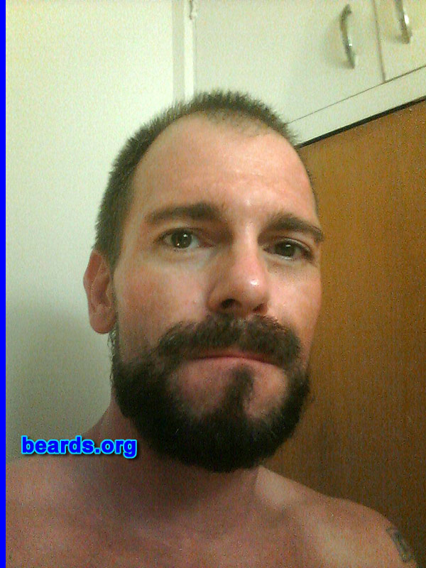 Josh C.
Bearded since: September 23, 2013. I am an experimental beard grower.

Comments:
Why did I grow my beard? I felt the need for a change in appearance to go along with a promotion from teacher to director. Masculinity and my Anglo-Saxon heritage are important to me and beards do a great job of conveying that.

How do I feel about my beard? I am very happy with both the fullness and dark color. After only four weeks it had already filled in nicely. 
Keywords: full_beard