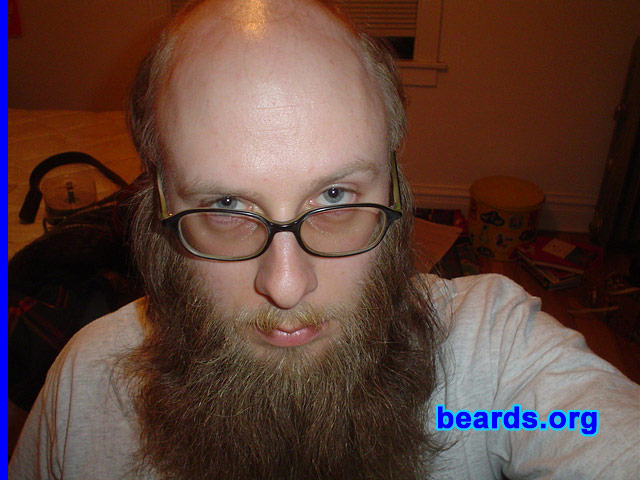 Laine
Bearded since: 1996.  I am a dedicated, permanent beard grower.

Comments:
I grew my beard because I hoped the sprouting hair would force the demons from my body.

How do I feel about my beard?  I hadn't had it as long as in this picture in about seven years. It was odd having it so long again, and I have since trimmed it back considerably, though I do still sport a full beard. I generally love my beard.
Keywords: full_beard
