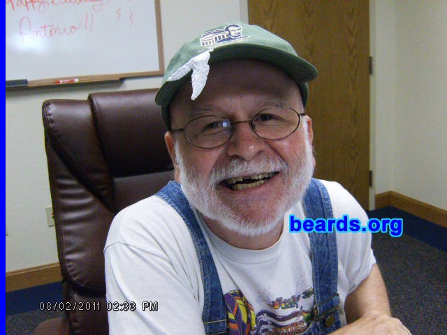 Tony K.
Bearded since: 1985.  I am a dedicated, permanent beard grower.

Comments:
I grew my beard because I wanted to be different. I am that as my beard now is santa white. I had brown hair back in 1986.  By 1993 the beard change color was nearly complete.

How do I feel about my beard? I prefer the full beard. Because of shaving "errors", I have had to slightly change facial hair features. The prime example is a mutton chop.
Keywords: full_beard