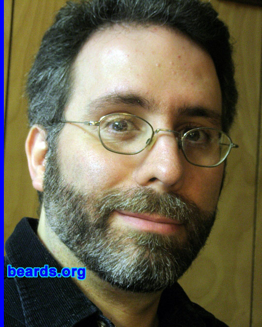 Tony
Bearded since: 2005.  I am a dedicated, permanent beard grower.

Comments:
I've been intermittently bearded for several years -- I grew it first mostly because I wanted to see what I looked like with it. And as it turned out, I liked it. I thought it made me look more mature (I have a bit of a baby face underneath it), and also kind of scholarly and professorial. When I turned forty, I decided to keep it.

How do I feel about my beard?  I love it -- the way it looks and the way it feels. It's pretty curly, so I have to keep it trimmed pretty short. Still, I love it and it's here to stay.
Keywords: full_beard