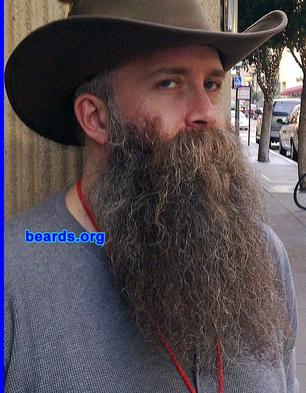 Andy
Bearded since: 2005. I am a dedicated, permanent beard grower.

Comments:
I grew my beard because I wanted to grow it back after shaving it off in 2005.  I also wanted to see how long it would grow.  Turns out that it's wavy when it gets long.

How do I feel about my beard? Sometimes I think about trimming it back to a short box style.  But when you have so much time invested in a long beard, any kind of trim seems almost sad and wasteful. I did have it trimmed by a beard barber this year and I'm glad I did.  I'm not going to risk trimming it on my own again.
Keywords: full_beard