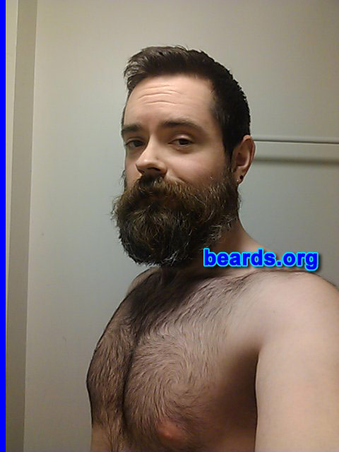 Geoffrey W.
Bearded since: 1997. I am an experimental beard grower.

Comments:
Why did I grow my beard? Because I can. I've always felt more comfortable with a beard. It's part of my identity. It's something I take pride in. I've been able to grow a full beard since I was sixteen. My adoptive father has had a beard for the last thirty years and when I met my birth father, he had a full beard. Other bearded men that have inspired me include Jerry Garcia and Commander William T. Riker.

How do I feel about my beard?  It's kind of like Batman, where my beard is my true self and my clean shaven face is the mask. I've been in bands for over twenty years now and I haven't been onstage without any facial hair at all since 2007. Three years ago I shaved clean just to remind myself. When my wife saw it she told me I was never allowed to do that again. Last summer my beard was long enough that you couldn't tell that I was wearing a bow tie at my brother's wedding.
Keywords: full_beard
