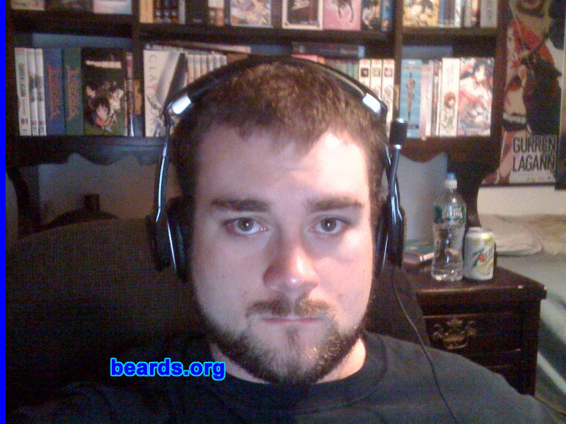 Travis C.
Bearded since: 2005.  I am a dedicated, permanent beard grower.

Comments:
Well I grew my beard originally because I used to work with a girl I had a thing for who said she liked men with facial hair.  So I ended up growing a mustache and a goatee. After that plan didn't work, I actually came to like it so much anyway that I decided to keep it. I recently decided to try the full face beard and I think I like it so far.

How do I feel about my beard? I have been having trouble finding a neck line that I am comfortable with because I am a bit self-conscious about my chubby neck but I think I am getting closer to finding the exact shape I am looking for. I know I'll be keeping some kind of facial hair for the rest of my life. I've been told it makes me look scholarly and more mature and it really goes well with my face. I am very happy with my facial hair.
Keywords: full_beard