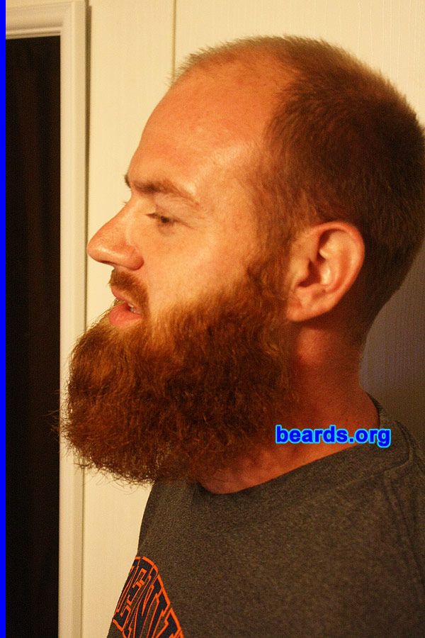 Will H.
Bearded since: 2011. I am a dedicated, permanent beard grower.

Comments:
I started out with a baby face, but as I got older and lost my hair I thought I would make up for it with a goatee. Last year my wife and I were joking around about me growing a full beard like my dad since I was on vacation. So about eight months ago I started and haven't stopped. We went through a few stages of long goatee, short full beard, etc. but people love the red and how big it is and we are always drawing attention, especially since we live in a small country town. It's always funny when people ask if I wash it and it's usually always the first thing someone asks about when they meet me. It's been an ongoing joke at my job and with family, but I am seeing just how long I can get it.

How do I feel about my beard? I love my beard full. At times it itches and drives me crazy, but overall I like having it. With age I am looking more and more like my dad, who also has a full beard, but only during certain months. I enjoy that it makes me stand out in a crowd and different than everyone else. 
Keywords: full_beard