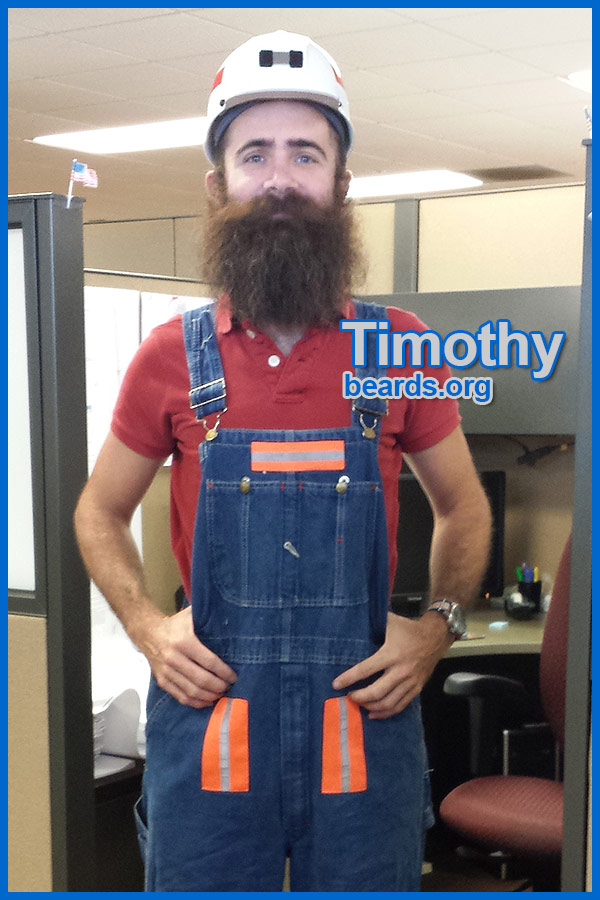 Timothy trying on gear for going down into a coal mine for his internship job.