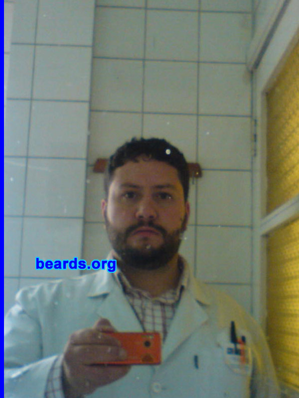 Sergio L.
Bearded since: 1998.  I am an experimental beard grower.

Comments:
When it grows, I look for different ways of shaving it. Everything began with my first shave.  When i was fifteen, my dad got me up.  I was even asleep and he made me shave my four crazy hairs that I had.  Since then, little by little it has grown more. Since aged nineteen, I liked to change styles.  I wait until it grows out and I try new way to shave it. Now I cannot be without a beard.

How do I feel about my beard? I feel it's too short.  I would like it to be longer for shaving it into more styles.
Keywords: full_beard