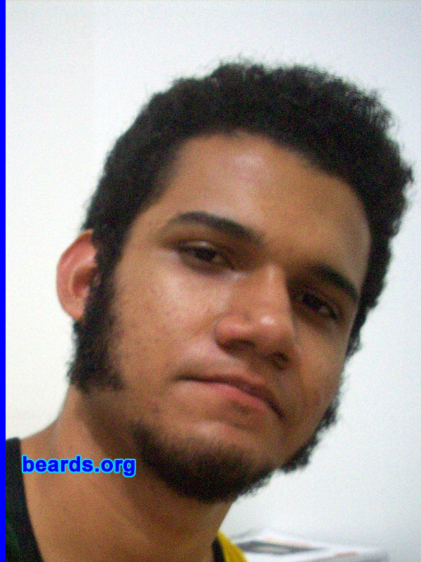 Antonio
Bearded since: 2005.  I am a dedicated, permanent beard grower.

Comments:
At first I was lazy. I didn't want to shave my beard when it started to grow (I was about fourteen). I must have shaved my sideburns once or twice when it started to grow, but I didn't like how I looked without them. Then, I just started to let them grow since the end of 2005, approximately. Bottom line, I grew my beard because I just like the way I look with it. I'm eighteen now when I'm writing this text and my beard is still growing.  And when it grows full I want to trim mutton chops or maybe friendly mutton chops.

How do I feel about my beard? I feel great about it! The overwhelming majority of my friends (both men and women alike) don't like it.  They think it's ugly and I should shave it. Of course I don't give a d@mn about what people say about my look, or what I should do about beard shaving, or what kind of clothes I should wear, etc. Also, girls in general don't like my beard, but why should I adequate myself to the rest of the world? After all, I do whatever I want!
Keywords: goatee_only