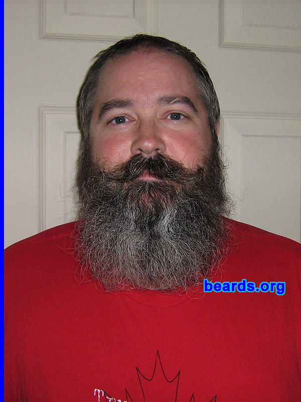 Wade
Bearded since: 1990.  I am a dedicated, permanent beard grower.

Comments
I grew my beard because I always wanted one...  Had a goatee/'stache as soon as I could grow one.  After my son was born, I let the full beard grow and kept it neatly trimmed (sort of) for years.  Last year, noticed the beard was getting thicker (and greyer!) and decided to let it grow out, mostly out of curiousity. The photos I uploaded are over the course of the last year.  The last time I trimmed my beard was March 2007.

How do I feel about my beard?  I love it... I foolishly shaved clean once some years ago. Lasted exactly one day.  Will never repeat that mistake as I hated my face with no hair on it! Current beard (getting quite long) is becoming harder to maintain, lots of split ends, tangles easily... I have to brush several times daily and I guess I should find a good conditioner... but I'm still growing it!
Keywords: full_beard