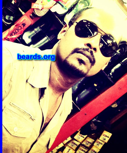 Mubarak I.
Bearded since: 2000.

Comments:
Why did I grow my beard?  For a manly look.

How do I feel about my beard? I am proud of my beard.
Keywords: goatee_mustache
