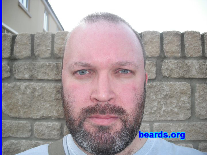 Andy
Bearded since: 2003. I am a dedicated, permanent beard grower.

Comments:
I started shaving at fifteen and I have always had a strong-growing beard.  I used to feel embarrassed about growing it too long, but no longer care.  I have received compliments saying I wear it well. It looks good on me! What do you think?

How do I feel about my beard?  I recently took a set of photographs for a new ten-year passport and drivers license.  So I feel extremely comfortable with it and would feel and look odd with out a full beard.
Keywords: full_beard