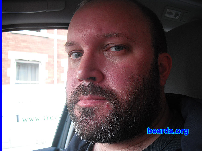 Andy
Bearded since: 2003. I am a dedicated, permanent beard grower.

Comments:
I started shaving at fifteen and I have always had a strong-growing beard.  I used to feel embarrassed about growing it too long, but no longer care.  I have received compliments saying I wear it well. It looks good on me! What do you think?

How do I feel about my beard?  I recently took a set of photographs for a new ten-year passport and drivers license.  So I feel extremely comfortable with it and would feel and look odd with out a full beard.
Keywords: full_beard