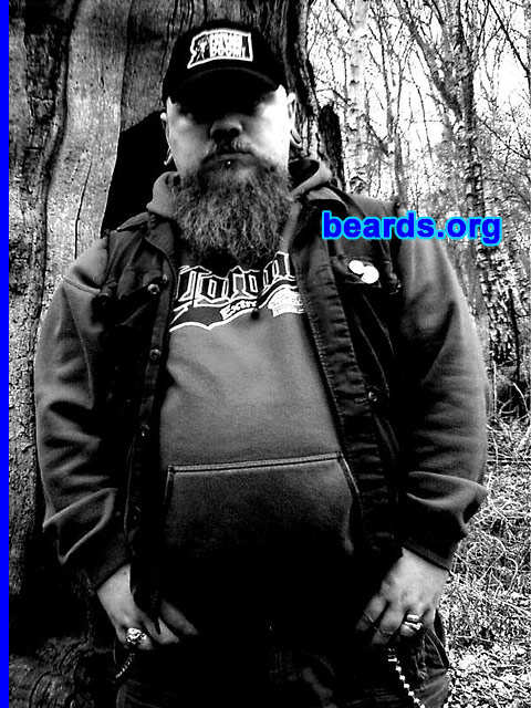 Stumpy
Bearded since: 1990.  I am a dedicated, permanent beard grower.

Comments:
I've grown hair on my chin ever since I could, from around the age of 15, as I have a small pimple/mole which I feel is unsightly. My beard has taken many forms, from full facial, to small goatee, with large sideburns, to what it is today. My hairline began to recede around the age of 20.  As I used to enjoy wearing my hair long, this came as a bit of a setback as the bald, mullet look was definitely not my thing!  So I shaved my head and have kept it shaven ever since. Thus came the experimentation with facial hair! 
-- I see my beard now as a tribute to my good friend Mark, who passed away last year. He had the thickest, most incredible beard known to man! I still have some way to go, but dude, this one's for you!!!

I think my beard is some kind of companion.  It's there when I'm at my desk pondering an issue or problem, it can be stroked in thought and I even have my own beard brush which can be soothing when stressed. Others see it as a conversation piece, asking how long I will grow it.  Or my father will tell me that I have my head on upside down...the usual stuff!  I just really enjoy my beard.
Keywords: goatee_mustache