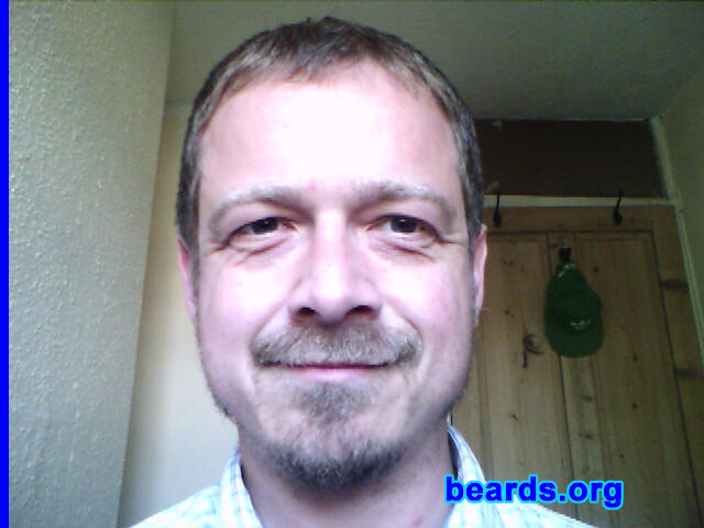 John
Bearded since: 1998.  I am a dedicated, permanent beard grower.

Comments:
I have always admired men with beards ever since I could remember and sort of slipped into having one during a period of unemployment originally and decided to let it grow to see what I could come up with. I've sort of sported one on and off since then, but have been a permanent grower since 1998. 

How do I feel about my beard?  I really do love my beard. It is a part of me and I cannot imagine myself without it. When I shaved it off once about two years ago I immediately began growing it again.It was just so weird being without it! I also recently changed jobs and made the choice that if I had to choose between either the beard or the job then the beard would have to win! Thankfully my employers are beard-friendly and it has been a pleasant surprise to discover that many of my male co-workers sport beards of all different varieties!
Keywords: goatee_mustache sideburns