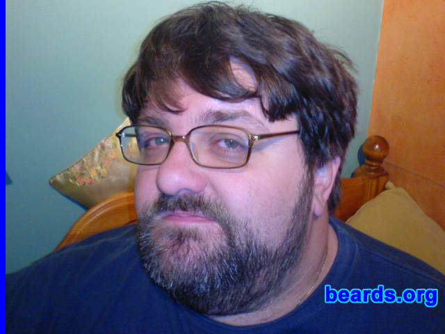 Laurence
Bearded since: 1994.  I am a dedicated, permanent beard grower.

Comments:
After years of working in retail and the service industry, where having a beard was frowned upon, I changed my job.  That meant I could grow a beard and so I did. I'd always wanted to, but when I was younger my growth wasn't up to much, but now it is and so my beard is a permanent part of me.

I love it.
Keywords: full_beard