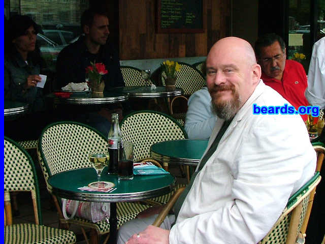 Steve Smith
Bearded since: 1991.  I am a dedicated, permanent beard grower.

Comments:
I grew my beard originally, I suppose, to make my face look stronger and more mature! It also gives you a certain control and authority over people. Granted I look a bit like a mad axe man, but as a friend once said to me, without it I wouldn't be me!

I like it.  It's become a part of me now and not having a beard doesn't really suit me anyway. My partner and cat like to snuggle up to it as well, so it's there forever now!
Keywords: goatee_mustache