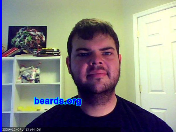 Dan P.
Bearded since: 2010.  I am an occasional or seasonal beard grower.

Comments:
I grew my beard because I spent 2005-2009 in the US Air Force and was required to shave nearly every day, except while on vacation. Initially, I grew my beard for about five months and then got antsy and shaved to handlebar. Currently, I have been growing my beard since May 2010.

How do I feel about my beard? I enjoy having a beard. I get lots of compliments. Sometimes people shout from afar, "Sweet beard!"  I'm twenty-seven and it is currently considered hip in my social circles to have a beard. I'm fairly impulsive and sometimes get the urge to shave or greatly trim, but my curiosity about how it might look in another six months motivates me to stick with it.
Keywords: stubble full_beard