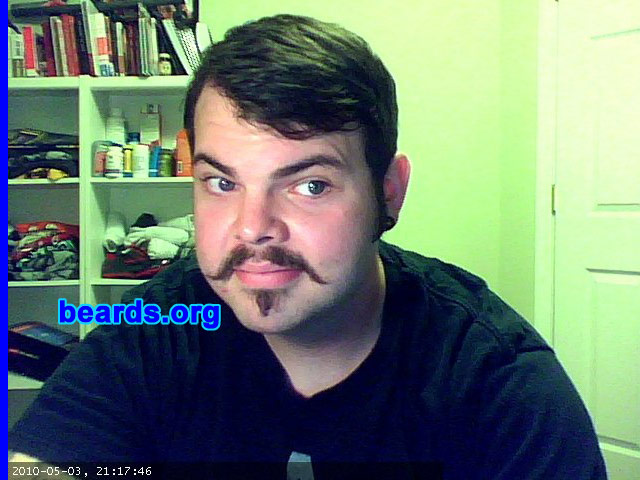 Dan P.
Bearded since: 2010.  I am an occasional or seasonal beard grower.

Comments:
I grew my beard because I spent 2005-2009 in the US Air Force and was required to shave nearly every day, except while on vacation. Initially, I grew my beard for about five months and then got antsy and shaved to handlebar. Currently, I have been growing my beard since May 2010.

How do I feel about my beard? I enjoy having a beard. I get lots of compliments. Sometimes people shout from afar, "Sweet beard!"  I'm twenty-seven and it is currently considered hip in my social circles to have a beard. I'm fairly impulsive and sometimes get the urge to shave or greatly trim, but my curiosity about how it might look in another six months motivates me to stick with it.
Keywords: chin_strip soul_patch mustache