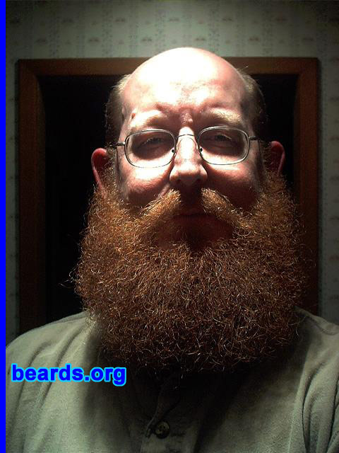 Tim
Bearded since: 2000.  I am an occasional or seasonal beard grower.

Comments:
I grew my beard just to see what it looked like. I had been clean shaven most of my life. Occasionally, I would grow for a week or so and shave it off. When I hit 40 I decided to let it grow and had no idea what it would look like. I was pleasantly surprised. 

How do I feel about my beard?  I love it. I like the color and how curly it is. I described myself as an occasional or seasonal beard grower because for the last seven years I have grown for 10 to 12 months and would then shave and regret it every time. Usually I would immediately start regrowing. The picture I posted was 13 months growth, the longest I'd ever grown it. Once again I shaved and started growing the next day. Everyone I know, including my wife, was disappointed when I shaved it off. I have now joined the ranks of permanent beard grower. I am currently at 3 months. Will keep you posted with my progress.
Keywords: full_beard