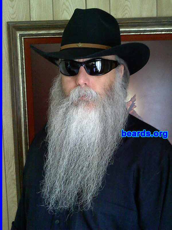 Steven
Bearded since: 1975. I am a dedicated, permanent beard grower.

Comments:
Why did I grow my beard? Though my first (at sixteen years old) facial display was a mustache and long sideburns, I grew my first beard immediately upon discharge from the military. I have always liked beards, particularly full ones. I've always had facial hair of one form or another and a full beard has probably been the higher percentage over the years. Probably about the last year or year and a half, I've gone "full natural". It is fun being a part of the present interest that is going on, but I had a beard before it all came about, and will have one after, if it were to die off.

How do I feel about my beard? I fully enjoy it. I sometimes wish it were more dense.  But, it is what it is.  So I just "Keep on Trucking", as the ole saying goes. Its color and size has drawn my interest to perhaps try the Santa gig this coming Christmas.  We shall see. : )
Keywords: full_beard