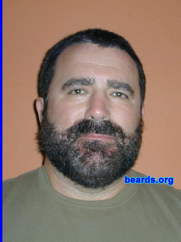Harvard  (photo 1)
Bearded since: On and off.  I am an occasional or seasonal beard grower.

Comments:
Current regulations concerning the use of respiratory protection (29 CFR Part 1910.134) require the "The employer shall not permit respirators with tight-fitting facepieces to be worn by employees who have....Facial hair that comes between the sealing surface of the facepiece and the face or that interferes with valve function..." So, as an industrial hygienist, I started thinking, what kind of beard would meet this requirement, i.e. no facial hair at the sealing surfaces. So I grew out my beard (photo 1), took a standard half-face respirator, powdered it with talcum powder and pressed it to my beard (photo 2). Anywhere there was powder, I shaved. I did this repeatedly, until I had no facial hair in contact with the sealing surfaces of the mask (photo 3). This type of beard may be worn while wearing a half-face respirator, in compliance with 1910.134.

How do I feel about my beard?  I was not too keen on my respirator compliant beard, but when my eight-year-old daughter said she would not kiss me goodnight, it had to go. But if someone who wears a respirator really, really, REALLY wants to have a beard, this one is regulatory compliant.
Keywords: full_beard