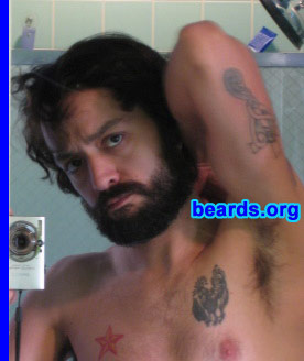 Ian
Bearded since: 2008.  I am a dedicated, permanent beard grower.

Comments:
I wanted to see what my beard would look like if I just let it grow. Before this beard, I always had a goatee, mustache, or fu-manchu and I just got tired of the trimming. I only shave a one-inch strip at the bottom of my neck now.

How do I feel about my beard?  I think it's pretty cool. It's definitely a work-in-progress. I think I want to grow it until it's long enough to braid it.
Keywords: full_beard