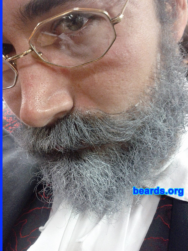 Jason L.
Bearded since: 1999. I am a dedicated, permanent beard grower.

Comments:
I've always been one to experiment with my physical appearance. Once the hair on my face started to grow it was all about fun. Started with a chin strap for a few years, went clean (stubbly) for a year, then grew it full for the long haul here. I shave it down mistakenly every other year or so and quickly realize the error of my ways. It's good to keep the hair fresh though.

How do I feel about my beard? I love it. I just wish I could figure out how to have my 'stache really long and not waxed nor in my food. Although having a messy ice cream beard in the summer can be fun. I just feel naked without it nowadays. Just part of who I am, nothing special.
Keywords: full_beard