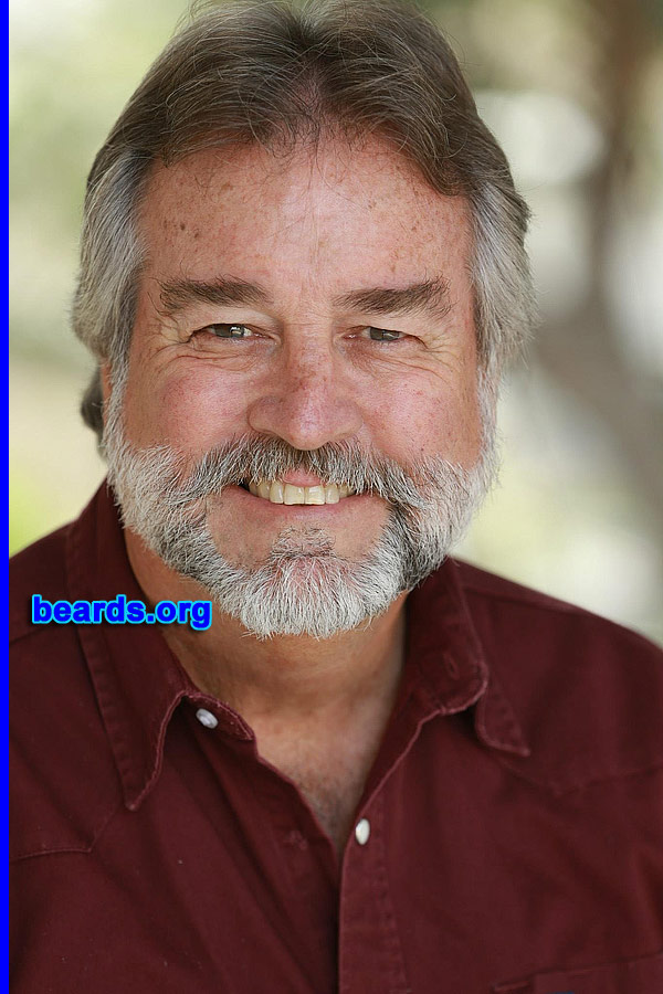 Jeff M.
Bearded since: 1970. I am a dedicated, permanent beard grower.

Comments:
Why did I grow my beard? Because of the desire since reporting aboard my Navy ship during Vietnam Nam war era. Had to stay aboard ship for over a month to satisfy personnel inspection and I.D. requirements.

How do I feel about my beard? It has become my signature feature, ever-evolving as it grays and silvers with its distinctive markings. Shaved off perhaps a half dozen times in the intervening years. Negotiated extra money to shave for a movie that I was involved in. Whilst living in the West Indies, I returned to the island clean shaven after a holiday break. Native Rastafarian greeted me saying "you lose ya strength, mon!"
Keywords: full_beard