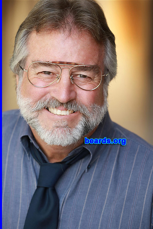 Jeff M.
Bearded since: 1970. I am a dedicated, permanent beard grower.

Comments:
Why did I grow my beard? Because of the desire since reporting aboard my Navy ship during Vietnam Nam war era. Had to stay aboard ship for over a month to satisfy personnel inspection and I.D. requirements.

How do I feel about my beard? It has become my signature feature, ever-evolving as it grays and silvers with its distinctive markings. Shaved off perhaps a half dozen times in the intervening years. Negotiated extra money to shave for a movie that I was involved in. Whilst living in the West Indies, I returned to the island clean shaven after a holiday break. Native Rastafarian greeted me saying "you lose ya strength, mon!"
Keywords: full_beard