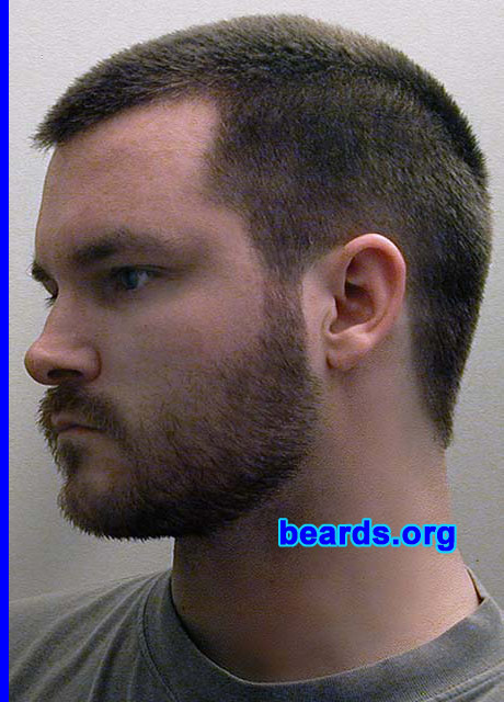 Kenzie LaMar
Bearded since: 1999.  I am a dedicated, permanent beard grower.

Comments:
I grew my beard because  I love them on men and had wanted one for myself for years, but couldn't grow one that looked full enough.  When I turned 21, I finally let it grow fully.  It was almost there.  I shaved it and then regrew it a year later.  Had one ever since.  I do art of bearded men.  I am a trained painter.  I am a pogonophile and love hair growth all over the male body.

How do I feel about my beard?  I like it and get lots of compliments that it looks good on me.  I wish it were more full and had less bald spots.  I would like it to be darker, too.  I am trying to grow it a bit longer now, but the hair is so straight that it just starts to stick out everywhere and looks bad.  Guys that have a bit of a curl seem to be able to let therr beards grow much longer and it looks good.  My beard isn't full enough to grow a really long beard.  It would look really bad.  That's fine, though, because I like shorter beards to medium length.
Keywords: full_beard