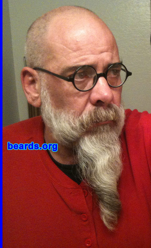 Michael K.
Bearded since: 1978.  I am a dedicated, permanent beard grower.  I am an occasional or seasonal beard grower.  I am an experimental beard grower.

Comments:
I grew my beard because I come from a bearded family.   So it was, without question, the thing to do. As far as the question as to the type of beard grower I am, I feel like I fall into all three descriptions: bearded since forever, but it changes with the season and I am experimental with it. I spent my first fifty-three years in the northeast and was almost fully bearded all the time. Now that I live in southern California, I do cut it back to a goatee when it's 110 degrees out. The goatee part is now two years old and growing.

How do I feel about my beard? Hmmm, it's just a part of me and I've enjoyed the changes to now being nearly all white. I also like the fact that my goatee section grows into a ringlet. The most asked question is do I curl it?, NO it grows that way. I do take better care of it now that it's grown to the top of my tummy and continuing to grow. I am glad that the holidays are over and beard-pulling season with it!
Keywords: full_beard