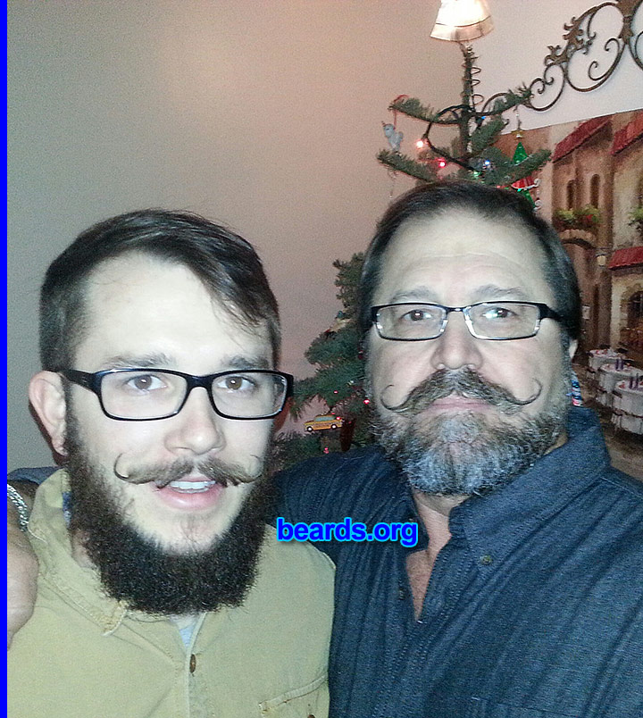 Michael C.
Bearded since: 1980. I am a dedicated, permanent beard grower.

Comments:
Why did I grow my beard? Familial responsibility! Any men who can't or don't grow a chin-crop have to change their name or take their wife's maiden name. Just sayin'! In this pic my son and I are practicing our Christmas tradition of Christmas Curloing, get it CURL-O-ING ?! ;-)

How do I feel about my beard? Could grow fuller! Could grow faster!
Keywords: full_beard