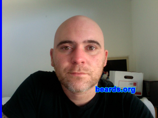 Titus O.
Bearded since: 1989.  I am an experimental beard grower.

Comments:
I started my first at seventeen because none of my friends could. I have stayed clean shaven most my life and now at thirty-five I am going for my first full beard.

How do I feel about my beard?  It is only the first week since I dedicated myself to a full beard and I feel like some strange creature is growing on my face. This is not unpleasant, just odd.
Keywords: stubble full_beard