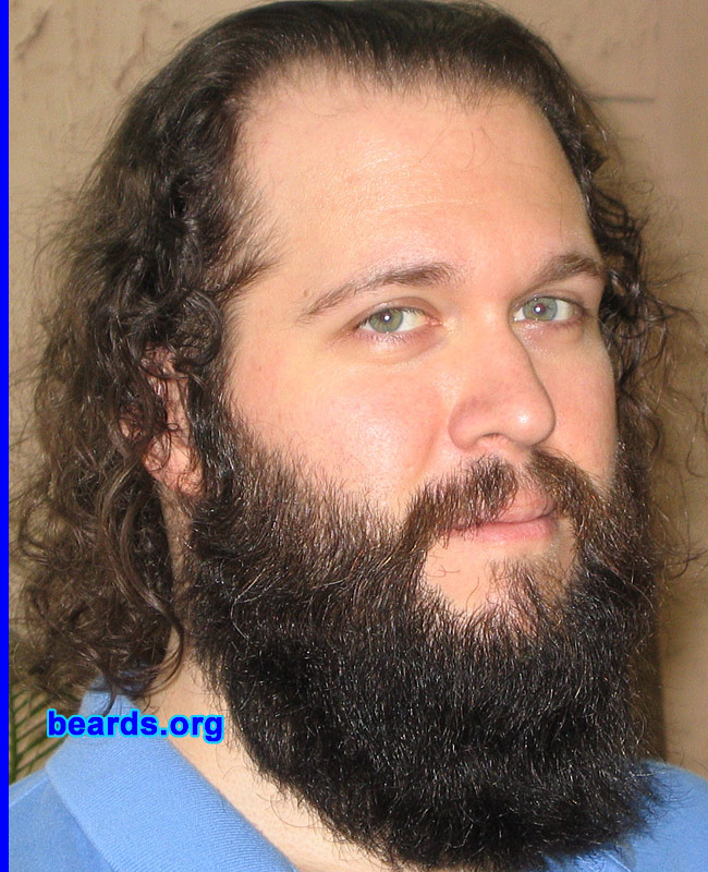 Daniel S.
Bearded since: 1997.  I am a dedicated, permanent beard grower.

Comments:
I grew my beard as an experiment in self-discovery.  It stayed short and "modern" for a while until I decided to embrace its fuller, more bushy nature.

How do I feel about my beard? I wouldn't feel like myself if I didn't have a beard. It's been a part of me for over thirteen years.
Keywords: full_beard