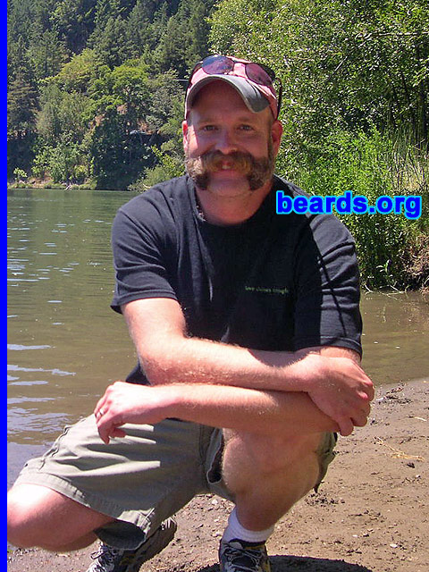 John
Bearded since: 1999.  I am a dedicated, permanent beard grower.

Comments:
I have grown a beard off and on since I was 15.  I am from the mountains of East Tennessee, where there must be something in the water that promotes exceptional beard growth.  They are everywhere -- every shape, size, and color!
 
How do I feel about my beard?  I like my beard because it is a changing work in progress. Self expression through one's facial hair is a beautiful thing -- as seen throughout this awesome website.  Heredity was good to me when it came to hair follicles per square inch.
Keywords: mutton_chops
