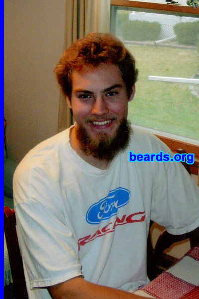 Chris
Bearded since: 2005.  I am an experimental beard grower.

Comments:
I grew my beard because I wanted to see what it would look like when it was long with all the bald spots filled in.

How do I feel about my beard?  I wish it were thicker, but I love it.  I grew it for six months when I was 17. I would grow it long again, but I am a college student and do internships, so I have to look clean.
Keywords: goatee_mustache