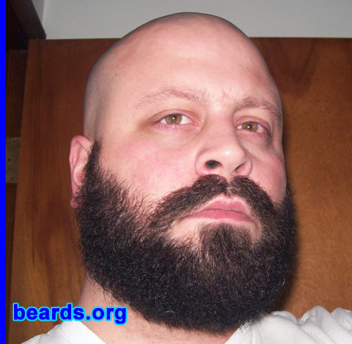 Jeremy M.
Bearded since: 2008.  I am an experimental beard grower.

Comments:
I have always wanted a beard, but the wife wasn't having it. I also had trouble getting past the itchy stage, so I always just cut it off. On Nov first I finally decided to go for it and two friends and I made a bet to give us an excuse to grow them and to keep our wives off our back. We weren't allowed to trim or do anything to them, except keep them clean of course. One of my friends gave in when his girlfriend started holding out on him.  We still give him a hard time about that. As of January 12th, it is still my friend Matt and I. Today we did make a change to the bet. We agreed that we would allow the neck to be trimmed (it was getting way out of control) but only the neck. I rushed home and trimmed my neck and took the picture that I'm attaching. 

How do I feel about my beard?  I love it now. I just need to find a good 'stache wax to get the mustache under control and out of my mouth.
Keywords: full_beard