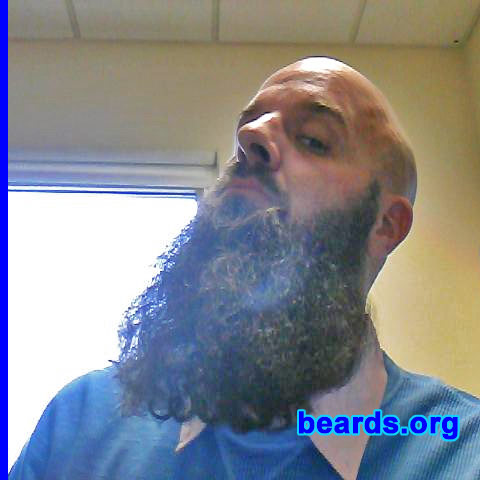 Rob T.
Bearded since: October 2011, off and on. I am a dedicated, permanent beard grower.

Comments:
I've been bald since 1994. That was a little before it was commonplace to see a bald Caucasian. Without facial hair, people assumed I was sick. I grew a goatee and kept that past its fashionable expiration date. Perhaps I am right-side up and the rest of the world is upside down. My little daughter knows me as a bearded dad and prefers I continue to grow it "until it gets tangled in the ceiling fan and you can't go to work."

How do I feel about my beard? I feel great. I've never received so much curiosity and occasional positive acknowledgement for essentially, doing nothing! It's so grown in now, it's got its emotional hooks in me. To shave it off would be a nightmare, one I occasionally have.
Keywords: full_beard