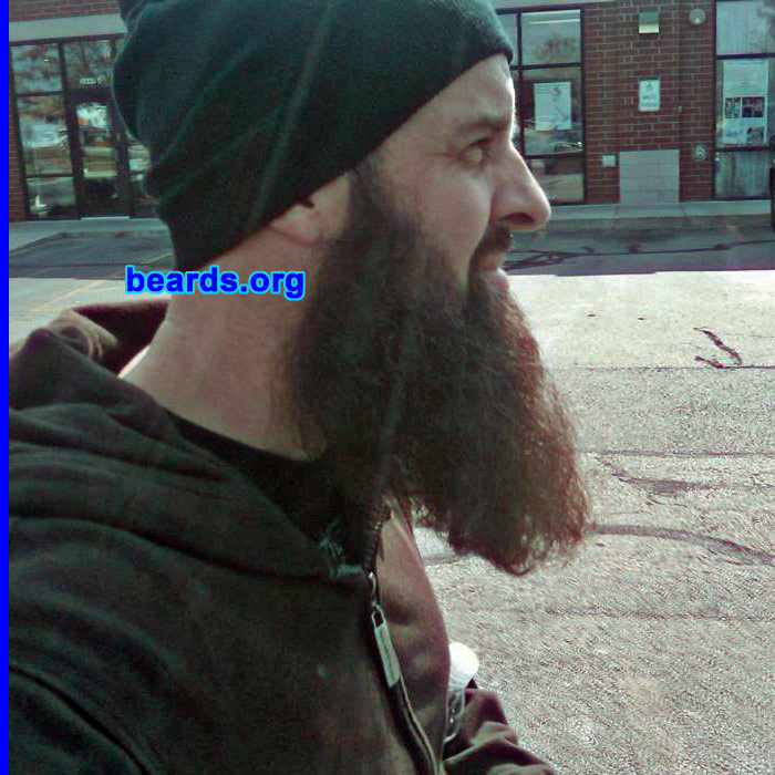 Rob T.
Bearded since: October 2011, off and on. I am a dedicated, permanent beard grower.

Comments:
I've been bald since 1994. That was a little before it was commonplace to see a bald Caucasian. Without facial hair, people assumed I was sick. I grew a goatee and kept that past its fashionable expiration date. Perhaps I am right-side up and the rest of the world is upside down. My little daughter knows me as a bearded dad and prefers I continue to grow it "until it gets tangled in the ceiling fan and you can't go to work."

How do I feel about my beard? I feel great. I've never received so much curiosity and occasional positive acknowledgement for essentially, doing nothing! It's so grown in now, it's got its emotional hooks in me. To shave it off would be a nightmare, one I occasionally have.
Keywords: Rob T.