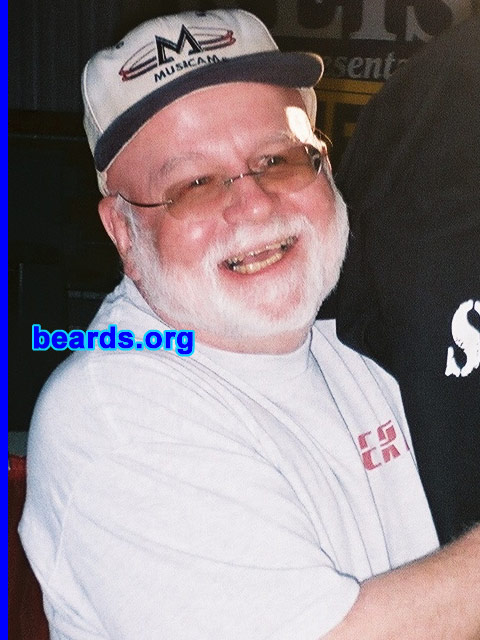 Tony K.
Bearded since: 1985.  I am a dedicated, permanent beard grower.

Comments:
When you are the geeky type, you do things not conventional.  So I grew a beard.  Relatives of mine had beards, but I never had the opportunity to meet them. They had passed away before 1952 when I was announced to the world.

How do I feel about my beard?  I like it, though it did turn white.  So BEWARE, SANTA.  There is competition.
Keywords: full_beard