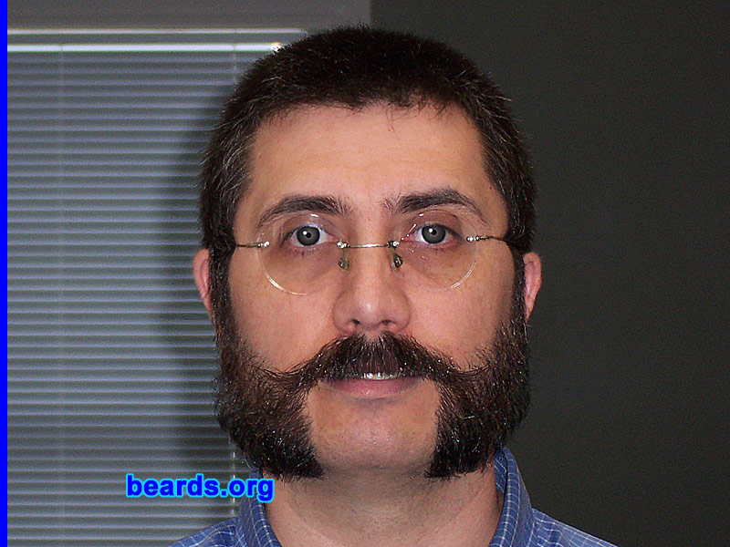 Hector R.
Bearded since: 2001.  I am a dedicated, permanent beard grower.

Comments:
I've always interested in the 'old days' look of men and their style. Needless to say, all of them had a proud beard or at least a mustache. 

So, I figured if it was good for them, it was going to be good for me. 

So here we are, I;m a bearded man and damn proud of it.

How do I feel about my beard?  It allows me to showcase any given mood. I can go classic with my friendly chops, or go beatnik with my goatee, or monk-like if I feel like it with my full face chin trim. 

It is impossible not to grin at the looks people give, especially when sporting an obviously anachronistic style like mutton chops or a Franz Joseph.

I like that people like it.
Keywords: mutton_chops
